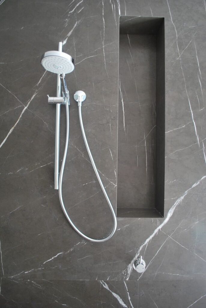 a picture of pitra gray marble applicated in the bathroom wall