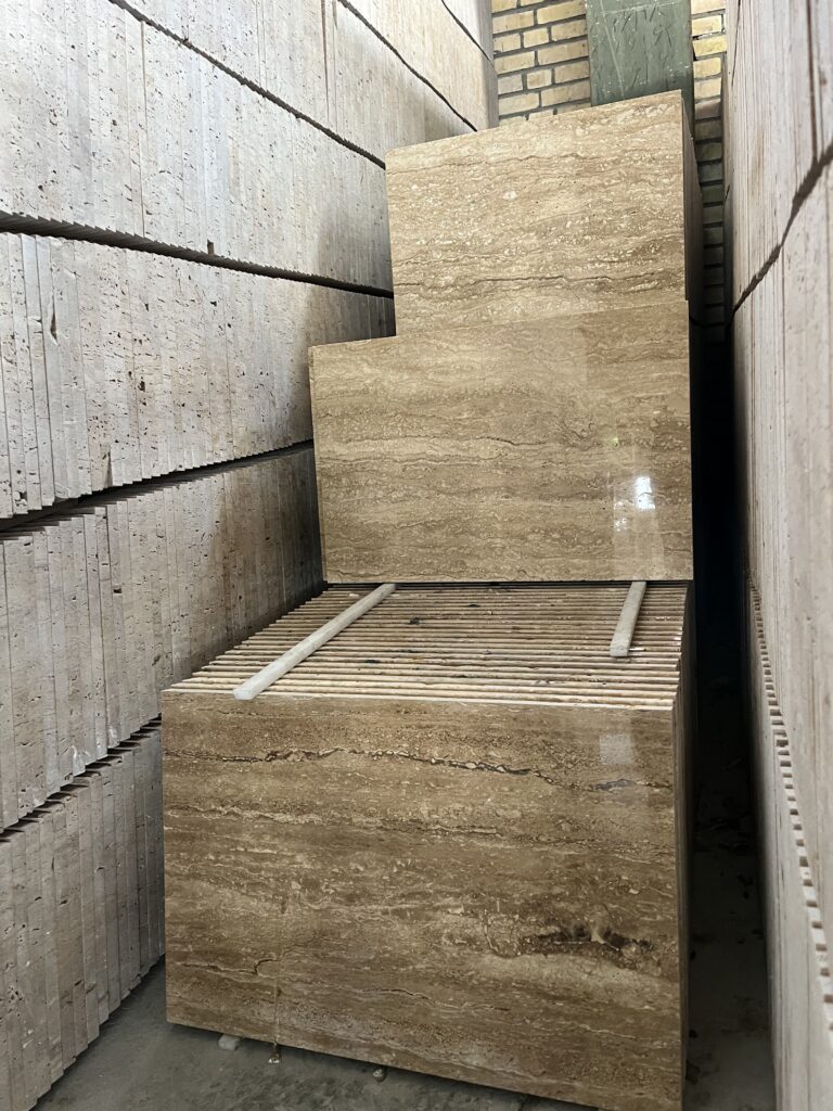 an image of 1.2 mm thickness noce travertine tile rows in factory